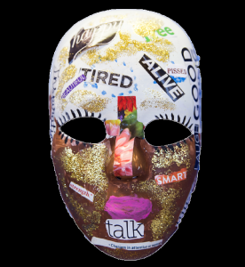 Unmasking Brain Injury mask painted gold and white with text on top