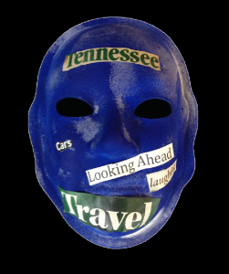 Unmasking Brain Injury mask painted blue with text cut out from magazines