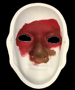Unmasking Brain Injury mask painted red and brown around the nose and eyes