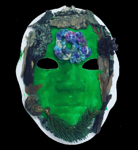 Unmasking Brain Injury mask painted green with black outline