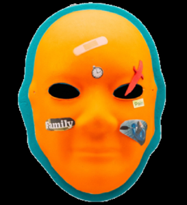 Unmasking Brain Injury mask painted orange with a blue outline and collaged materials