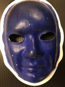 Unmasking Brain Injury mask painted black and blue