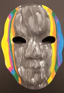 Unmasking Brain Injury mask painted black with multicolor stripes