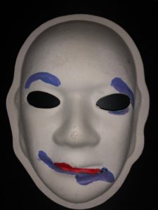 Unmasking Brain Injury mask painted with blue lines