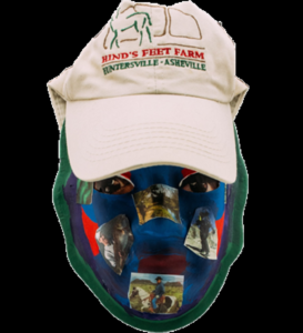 Unmasking Brain Injury mask with a ball cap