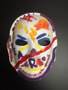 Unmasking Brain Injury mask painted with many colors