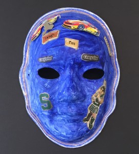 Unmasking Brain Injury mask painted blue with text