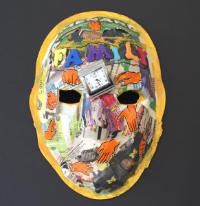 Unmasking Brain Injury mask painted in many colors with images collaged on top