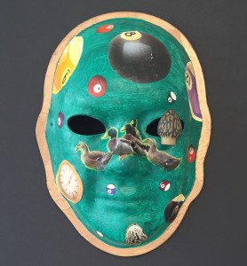 Unmasking Brain Injury mask painted green with ducks and pool balls