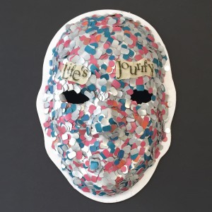 Unmasking Brain Injury mask with multicolored dots and the text "life's journey"