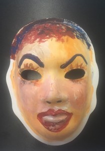 Unmasking Brain Injury mask painted with facial features