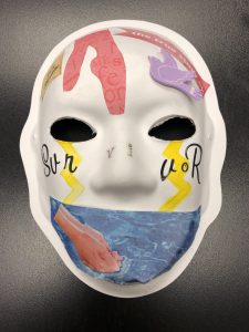 Unmasking Brain Injury mask with collaged images and text