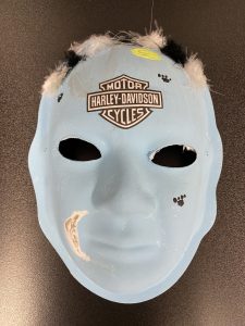 Unmasking Brain Injury mask with a Harley Davidson logo