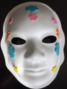 Unmasking Brain Injury mask with felt flowers