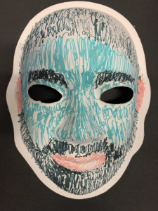 Unmasking Brain Injury mask painted blue with hair, eyebrows and a beard and mustache