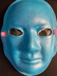 Unmasking Brain Injury mask painted blue with two pink spots