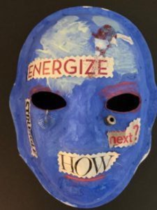 Unmasking Brain Injury mask painted blue with text