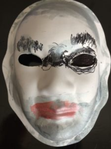 Unmasking Brain Injury mask painted with a face