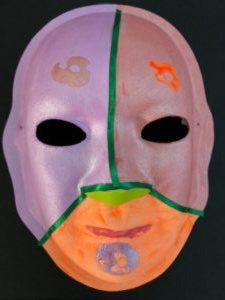 Unmasking Brain Injury mask painted with purple, pink and orange sections