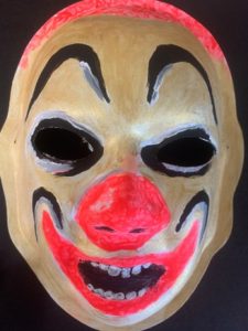 Unmasking Brain Injury mask painted like a scary clown