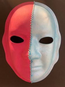 Unmasking Brain Injury mask painted half red half silver