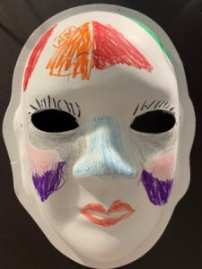 Unmasking Brain Injury mask with drawn on features
