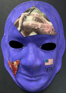 Unmasking Brain Injury mask painted blue with magazine cutouts collaged on