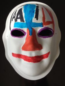 Unmasking Brain Injury mask painted with red, blue and black