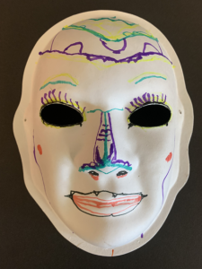 Unmasking Brain Injury mask painted white with drawn design
