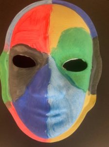 Unmasking Brain Injury mask with red, yellow, green, blue, black and brown segments