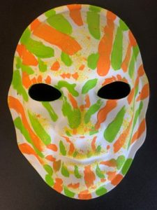 orange and green Unmasking Brain Injury mask
