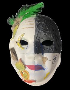 black and white Unmasking Brain Injury mask with a green feather and leaf decorations